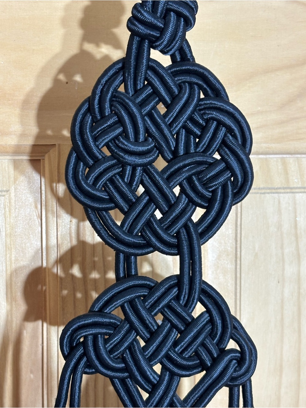 Black Decorative Macrame Wall Hanging with Knots and Tassels Shutara prayer rope